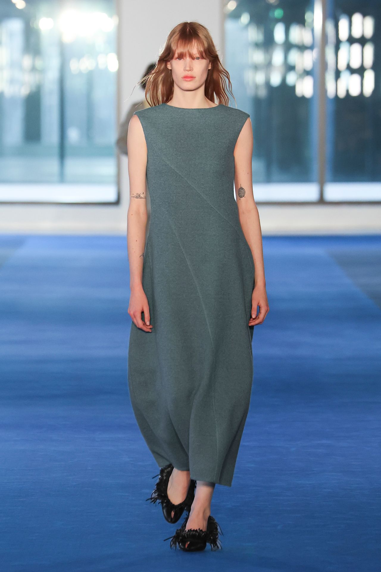 Image may contain Clothing Dress Evening Dress Formal Wear Adult Person and Fashion