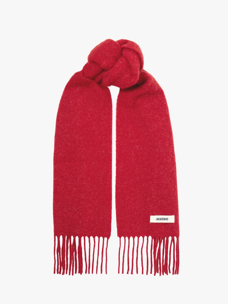 Image may contain: Clothing, Scarf, Stole, Hoodie, Knitwear, Sweater, and Sweatshirt